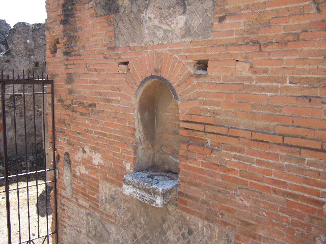 VII.9.42 Street altar 
at south entrance of Macellum 