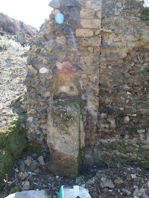 IX.8.8 Pompeii.  March 2009.  Street Altar on north side of entrance doorway.
