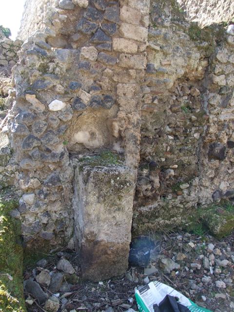 IX.8.8 Pompeii.  March 2009.  Street Altar on north side of entrance doorway.