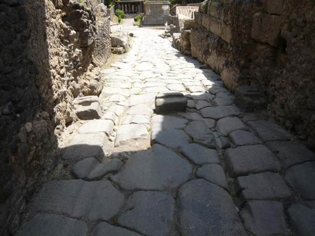 Pompeii Porta di Nocera. May 2015. Looking out to south. 
Three gate post mountings can be seen on the ground under the gate and the cart ruts in the road. Photo courtesy of Buzz Ferebee.
