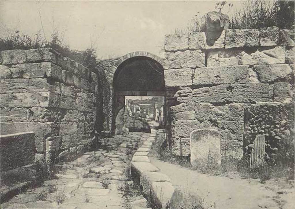 Porta di Stabia. Early 20th century. 
Looking north to Cippus of L. Avianius Flaccus and Q. Spedius Firmus, with lion spout perched on wall above. Photo courtesy of Drew Baker.

