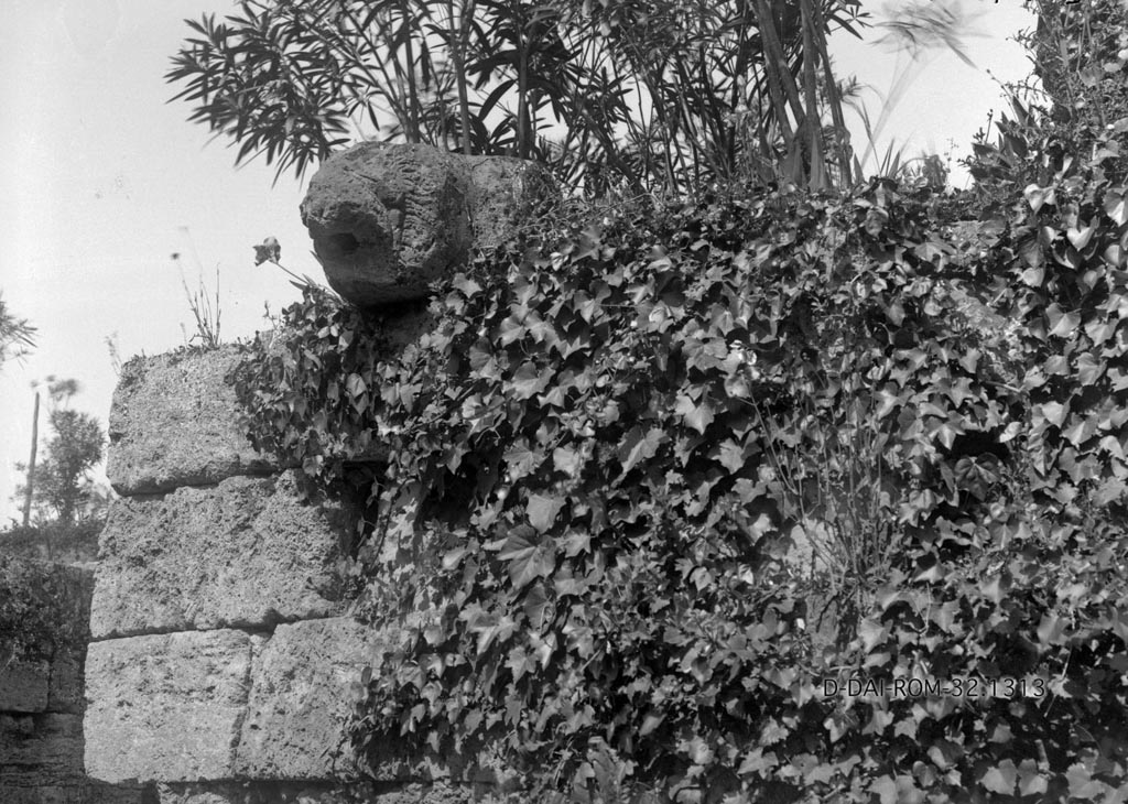 Porta Stabia. 1932. Lion spout. 
Photo by Erich Pernice.
DAIR 32.1313. Photo © Deutsches Archäologisches Institut, Abteilung Rom, Arkiv. 

According to Van der Graaff –
“Starting in 1874 through the end of the century, excavations resumed to expose the area in front of the gate. 
In addition to various tombs, excavators recovered a spout fashioned from a tuff block carved in the shape of a lion’s head. 
At first they identified it as the keystone to the gate vault, until August Mau recognized it as a spout that he believed was one of many that functioned to drain the wall-walk (Note 57).
Simpler versions of such spouts are indeed still present in the fortifications, but the lion head was a unique example that has since vanished (Note 58).
It may have functioned as a distinctive marker for the gate.” 
See Van der Graaff, I. (2018). The Fortifications of Pompeii and Ancient Italy. Routledge, (p.16).
