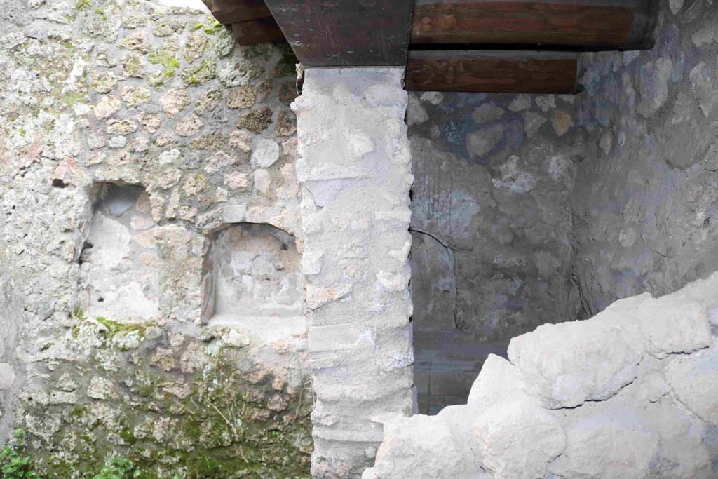 I.10.1 Pompeii. December 2018. 
Looking south towards two niches on wall of uncovered area, and third niche on south wall of latrine. Photo courtesy of Aude Durand.
