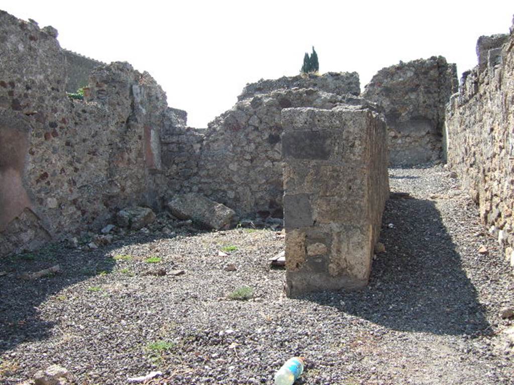 VI.2.29 Pompeii. September 2005. Looking west from entrance doorway along corridor to rear. According to Fiorelli, there was a lararium in the long corridor. See Pappalardo, U., 2001. La Descrizione di Pompei per Giuseppe Fiorelli (1875). Napoli: Massa Editore. (p.52)
According to Boyce, in the north wall of the corridor is a niche with peaked ceiling formed by two tiles set at an obtuse angle. Fiorelli referred to it as larario. See Boyce G. K., 1937. Corpus of the Lararia of Pompeii. Rome: MAAR 14. (p.44, no.144) 
