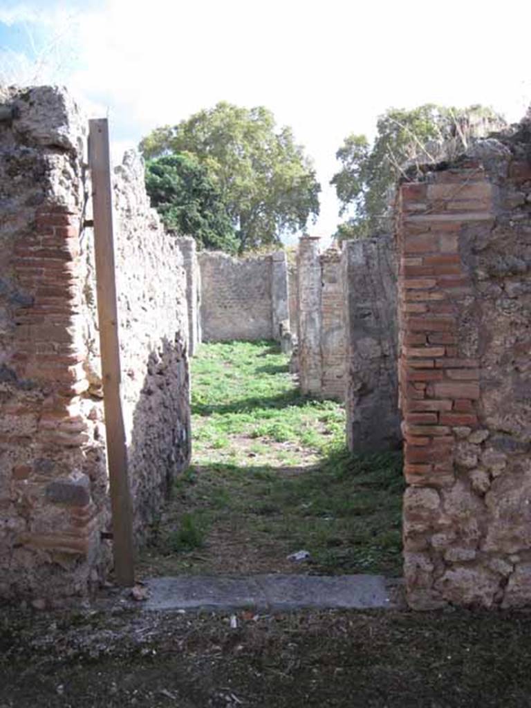 1.2.16 Pompeii. September 2010. Entrance doorway, looking south from across unnamed vicolo. Photo courtesy of Drew Baker.
According to Warscher, I.2.16  la casa  stata rifatta sugli avanzi di altra pi antica, caduta forse per il terremoto.
See Warscher T., 1935. Codex Topographicus Pompeianus: Regio I.2. Rome: DAIR.
(translation: I.2.16  "the house had been repaired from the remains of another more ancient one, fallen perhaps by the earthquake.)