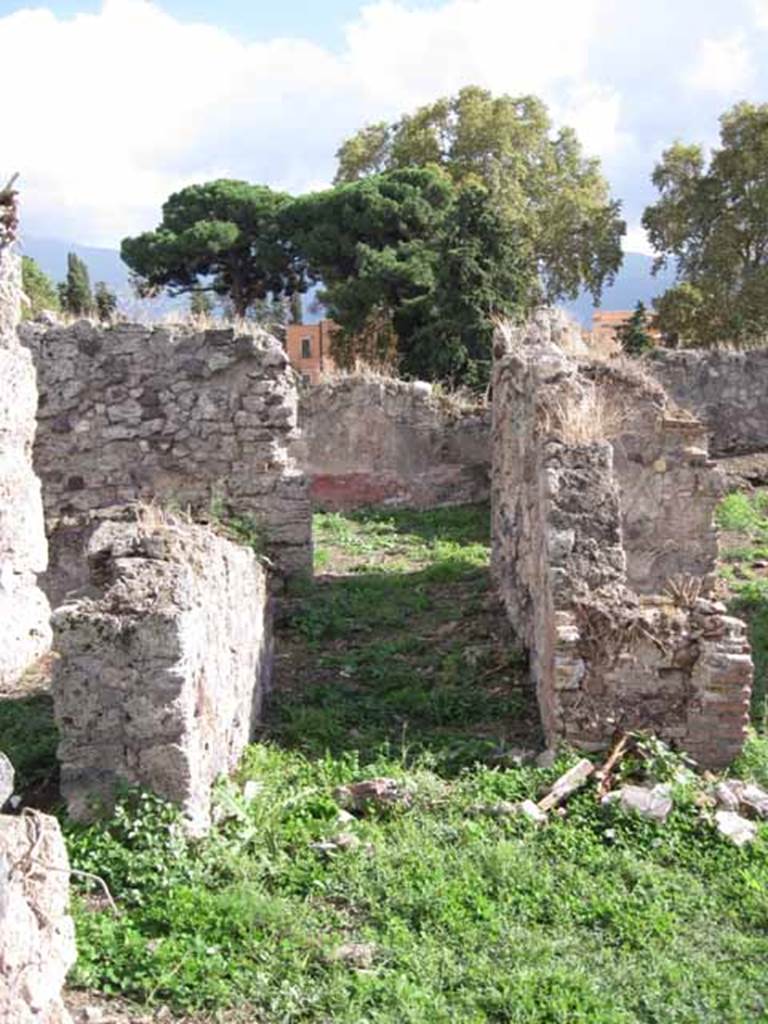 I.2.17 Pompeii. September 2010. Looking south from atrium into corridor, with doorway to room 11 (on the left). In the centre of the photo, is the doorway into room 10, triclinium. Photo courtesy of Drew Baker.
