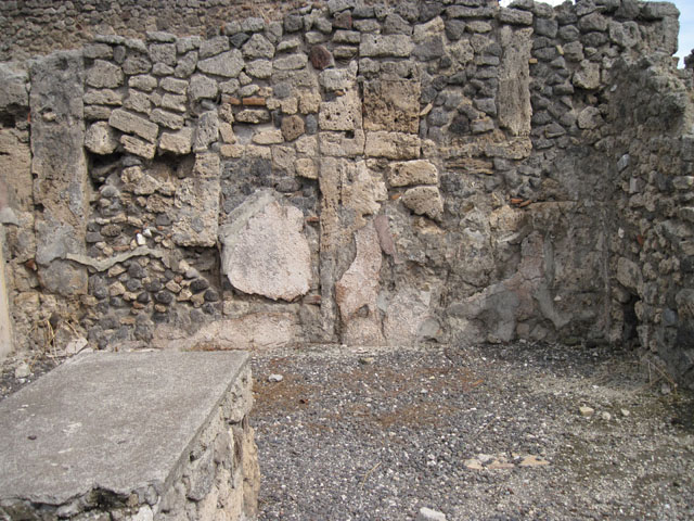 I.3.11. Pompeii.  May 2005. The area of I.3.9, I.3.10 and I.3.11 were disrupted years ago in the tunnelling of Fontana�s Canale del Sarno. 
Here a grille covers access to the canal.
