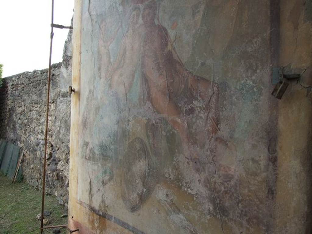I.7.12 Pompeii. December 2006. Wall painting on west wall of water tower, opposite the entrance. According to Jashemski, The large pillar at the west end of the lower part of the portico, camouflaged by a large painting of Mars and Venus, was actually a castellum aquae which had inserted in its top a reservoir (lined with good signinum) of a three-cubic-meter capacity. The water collected from the roof of the triclinium and the portico provided for the fountains, the elevation making possible the jets. The construction of the castellum aquae obstructed the view of the fine shrine, one of the best preserved at Pompeii. See Jashemski, W. F., 1993. The Gardens of Pompeii, Volume II: Appendices. New York: Caratzas. (p.40)
