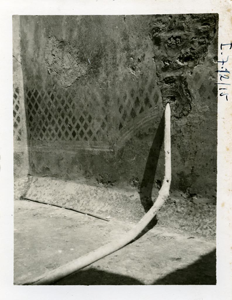 I.7.19 Pompeii but shown as I.7.12/15 on photo. Pre-1937-39. East wall of small garden area. 
Remains of painted trellis and lead pipe, which by 1972 had been cut off flush with the wall. 
Photo courtesy of American Academy in Rome, Photographic Archive. Warsher collection no. 1891.
