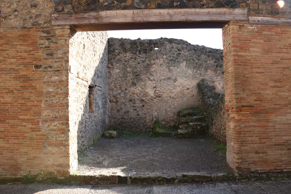I.8.7 Pompeii. December 2018. Looking south towards entrance doorway and across workshop. Photo courtesy of Aude Durand.