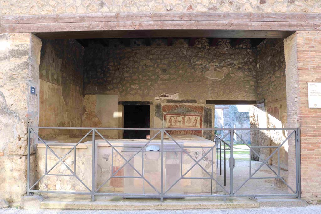 I.8.8 Pompeii. December 2018. 
Looking south into bar-room, with doorway to rear room, on left, and doorway to dwelling (I.8.9), on right. Photo courtesy of Aude Durand.
