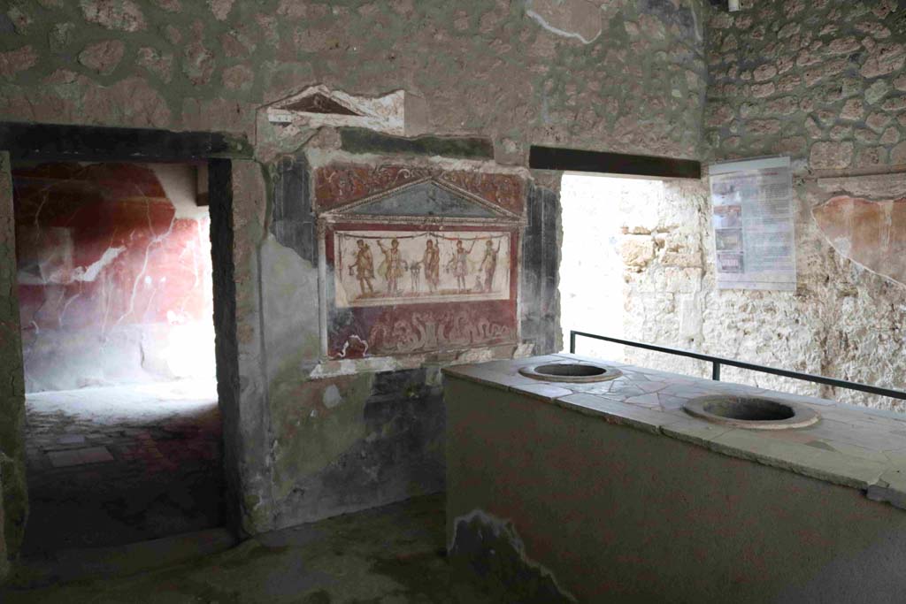 I.8.8 Pompeii. December 2018. 
Rear wall of bar-room, doorway to rear room, on left, doorway to oecus, atrium and dwelling, on right. Photo courtesy of Aude Durand.

