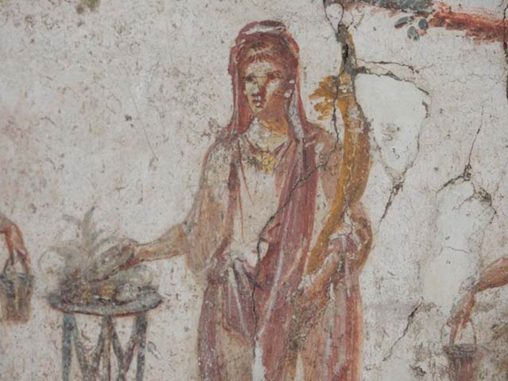 I.8.8 Pompeii. May 2015. Detail of the painted figure of the Genius of the household
Photo courtesy of Buzz Ferebee.

