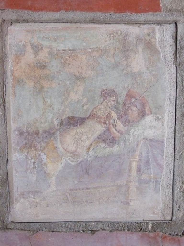 I.9.1 Pompeii.  March 2009.  Room 11.  South wall.  Wall painting of man and woman on a wooden bed.