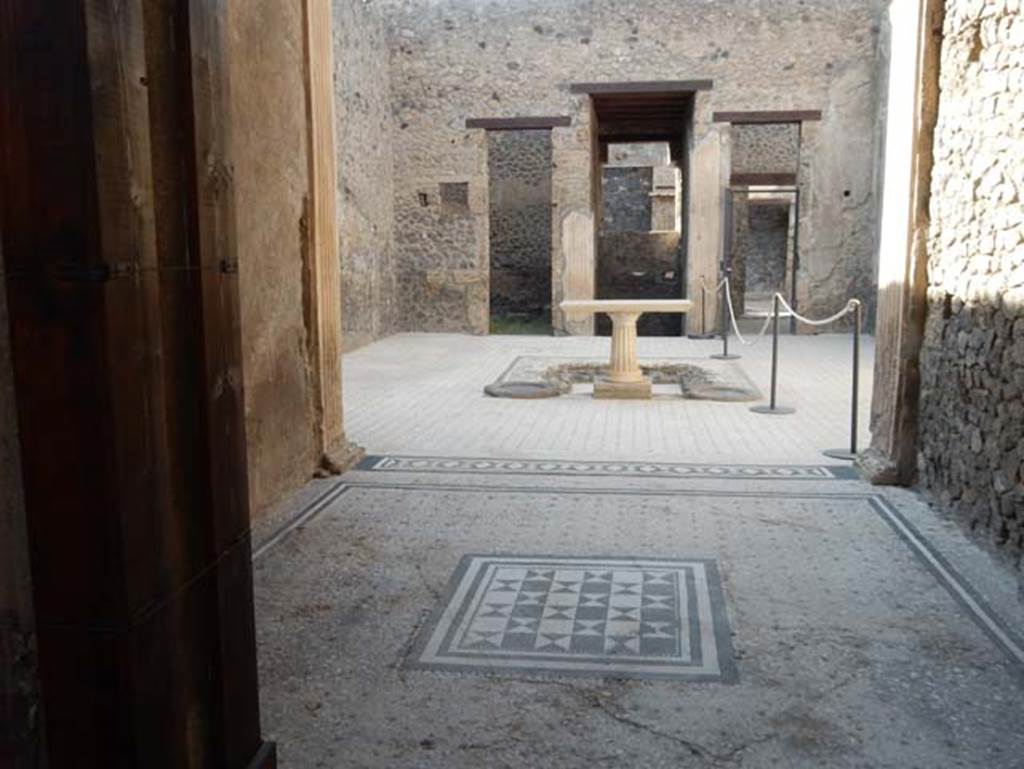 I.9.5 Pompeii. May 2017. Room 8, looking north across flooring in tablinum towards atrium and entrance corridor. Photo courtesy of Buzz Ferebee.
