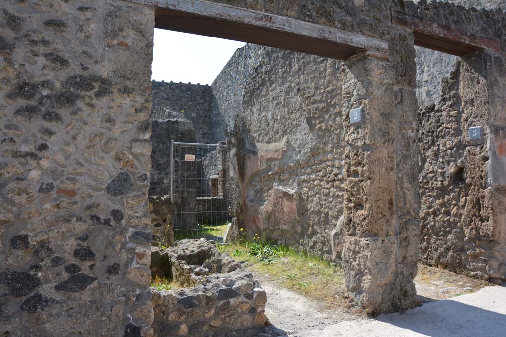 I.10.2 Pompeii. Looking towards entrance on south side of Vicolo del Menandro. Photo courtesy Adrian Hielscher.