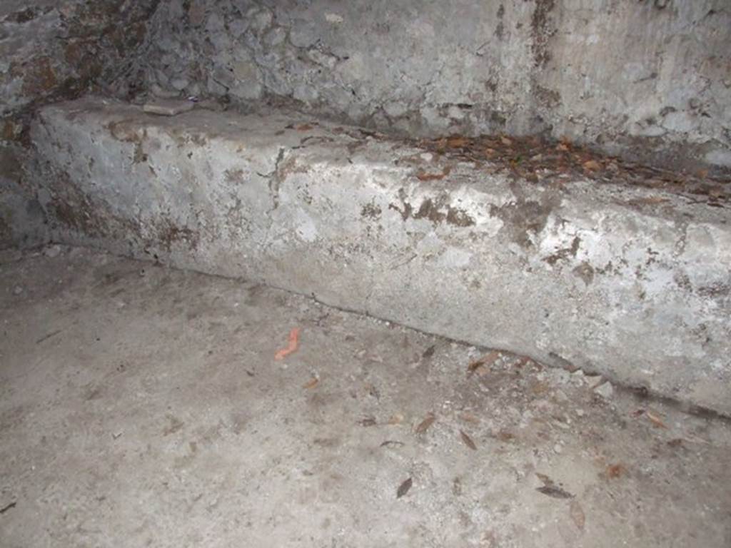 I.10.4 Pompeii.  March 2009.  Second Lower storeroom B.  North wall.  West end of bench against north wall.  The chest containing the famous silver collection was found approximately where the red mark is shown on the floor. 