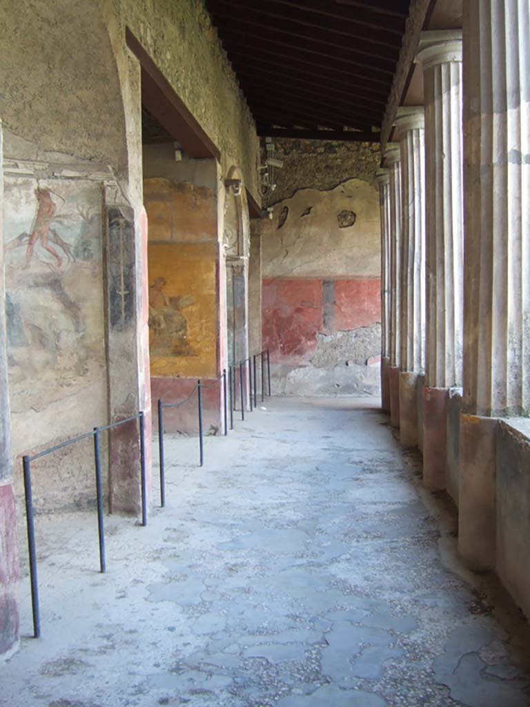 I.10.4 Pompeii. December 2006. 
Looking west along south side of peristyle with alcoves 22, 23, 24 and 25.
