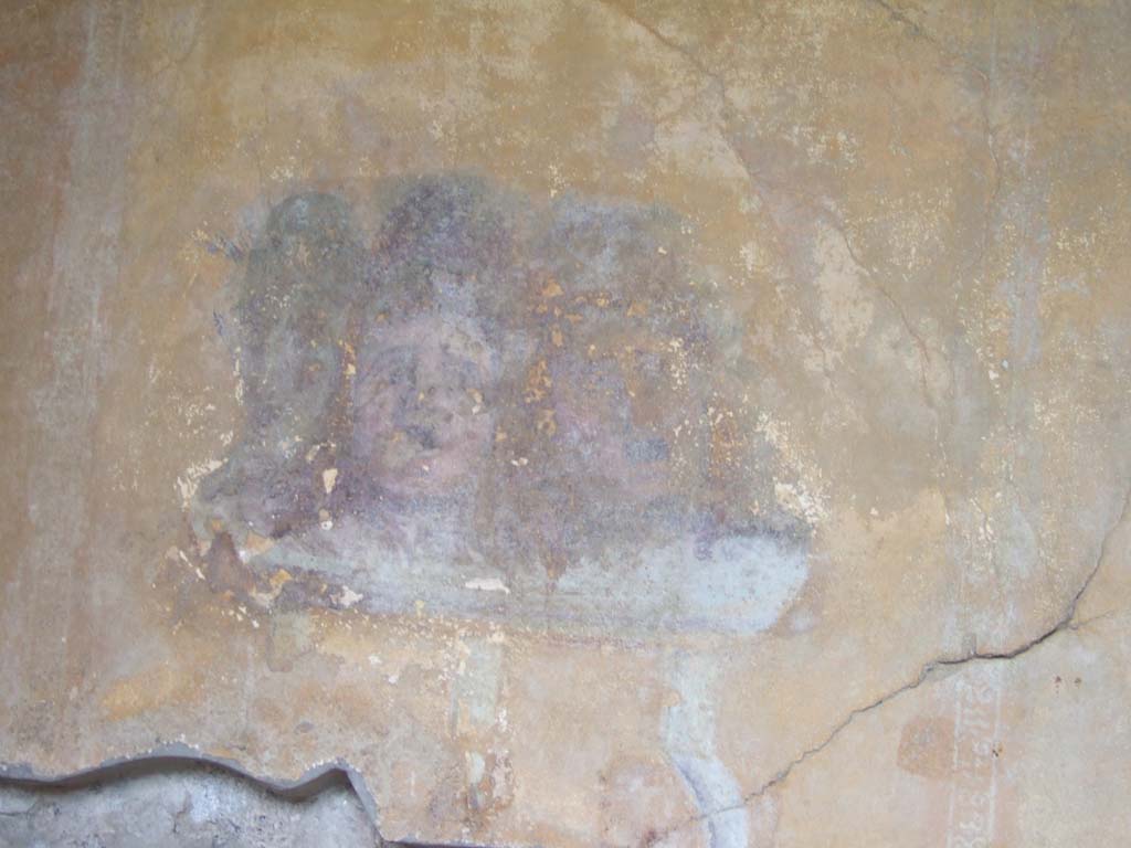 I.10.4 Pompeii. May 2006. Alcove 23. south wall at east end. Painting of theatrical masks. 