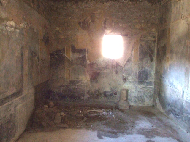 I.10.7 Pompeii. March 2009. Room 9.  South wall.  Remains of Lararium, with two serpents.