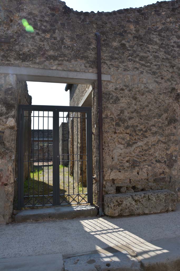 I.10.7 Pompeii. April 2017. Entrance doorway. Photo courtesy Adrian Hielscher.
According to NdS –
“Of all the large and small houses, of this insula, with the exception of the Casa del Menandro, this dwelling although modest, was the one that provided the most finds. A great deal of material was found in every room of the house, in which the number of objects, having a character of practical usefulness and intrinsic value, was remarkable.”
See Notizie degli Scavi, 1934,  (p.292)
For details of finds and their locations, 
See Notizie degli Scavi, 1934,  (p.292-308)
For details of “finds” from this house,
See Allison, P.M. (2006). The Insula of the Menander at Pompeii: Vol. III The finds, Clarendon Press, Oxford, (p.158-213, & p.337-349, & Suppl. p.275-283).
See Online Companion with details and photographs of finds from I.10.7.
