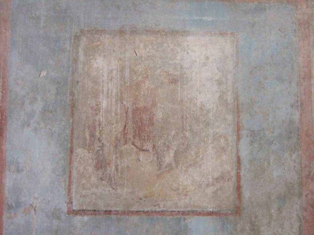 I.10.11 Pompeii. March 2009. Room 8, remains of central wall painting of Ariadne and Dionysus, from south wall of triclinium.  
See Bragantini, de Vos, Badoni, 1981. Pitture e Pavimenti di Pompei, Parte 1. Rome: ICCD.  (p.143).
Kuivalainen describes –
“A composition of at least five figures. In the right corner foreground is a reclining female with her face towards the viewer; her yellow cloak covers her legs and is lifted by a cupid, who stands behind her. In the middle, a standing youth watches the sleeping female. Next to him stand two others, one wearing a red cloak down to the hips.”
Kuivalainen comments –
“The foremost figure in the middle is Bacchus, and the one in the red cloak is Silenus. The pictorial programme of the room may concentrate on abandoned lovers, even if a better destiny awaits Ariadne.”
See Kuivalainen, I., 2021. The Portrayal of Pompeian Bacchus. Commentationes Humanarum Litterarum 140. Helsinki: Finnish Society of Sciences and Letters, (p.147, E8).
