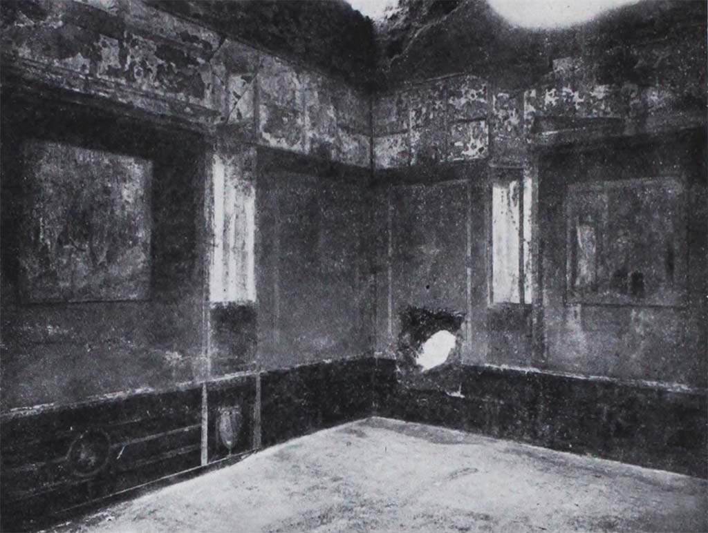 I.10.11 Pompeii. Room 8, looking towards painted decoration in south-west corner, and ancient hole in west wall of triclinium.  
See Notizie degli Scavi di Antichità, 1934, (p.330, fig.34).

