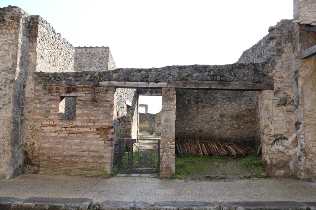 I.11.5 Pompeii, on left. December 2018. 
Looking south towards entrance doorway on Via dellAbbondanza. Photo courtesy of Aude Durand.
