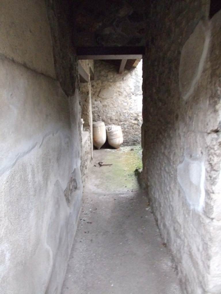 I.11.17 Pompeii. December 2007. Looking east along corridor to rear rooms, The triclinium window is on left.
