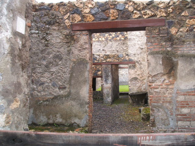 I.12.2 and I.12.1 Pompeii.  March 2009  Room 4.  Doorway into room 5.