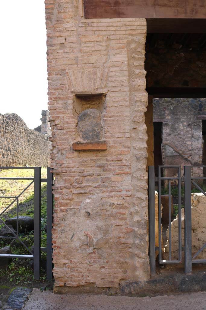 Street shrine or niche at east side of entrance doorway of I.12.5 Pompeii. 
December 2018. Photo courtesy of Aude Durand.
