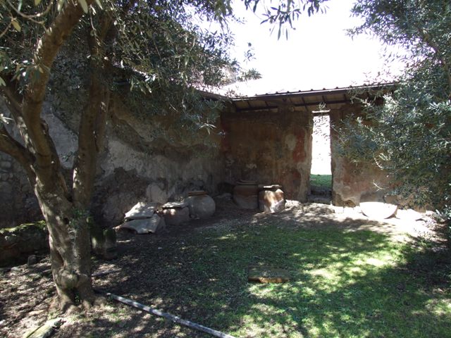 I.12.8 Pompeii.  March 2009.  East wall of room 5, with small door into room 7.