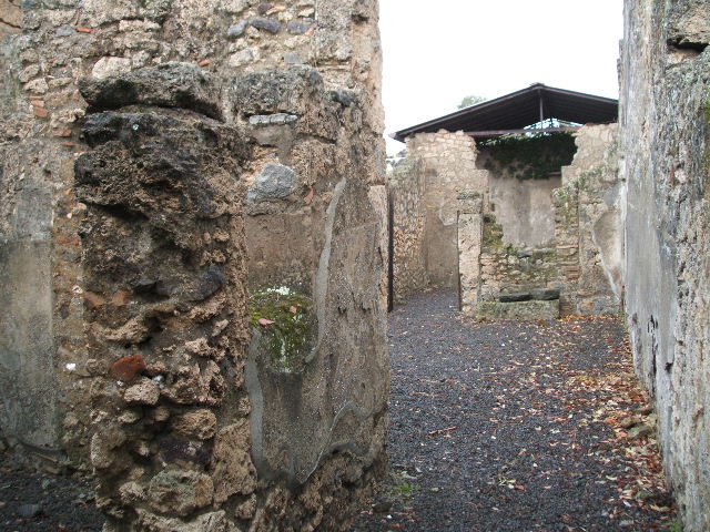 I.12.15 Pompeii.  December 2004.  Room 2. Cubiculum entrance on left and atrium ahead.