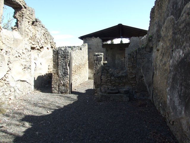 I.12.15 Pompeii.  March 2009.  Doorway to room 3.  Looking east into windowed Triclinium.
