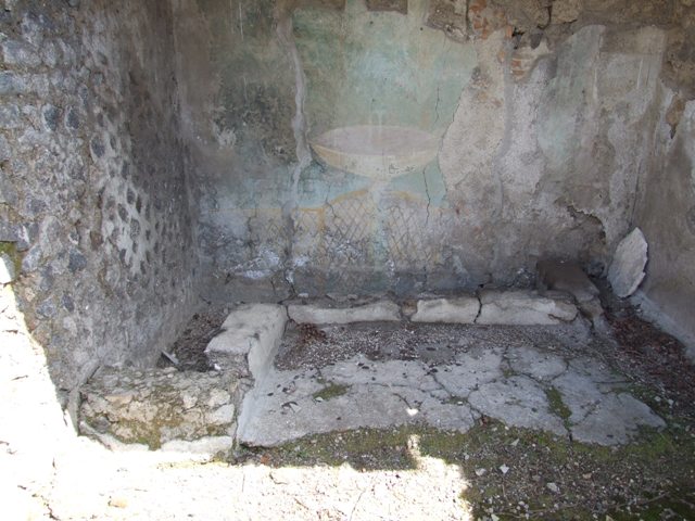 I.12.16 Pompeii.  March 2009.  Room 1. Atrium.  South wall.  Remains of painted Lararium.
