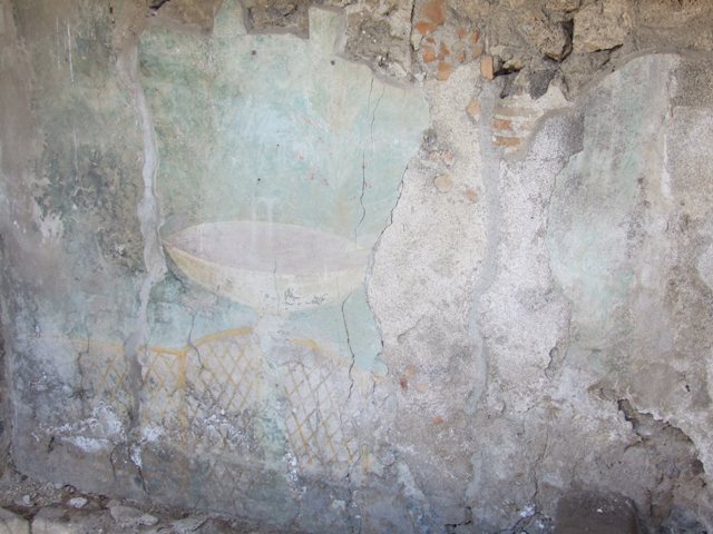 I.12.16 Pompeii.  March 2009.  Room 4.  East wall with garden painting, behind the small L-shaped planting bed, with raised edging.