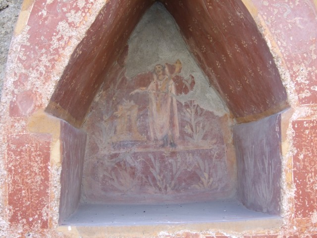 I.14.7 Pompeii.  March 2009. West outer side of the Lararium, with faded painted plants.