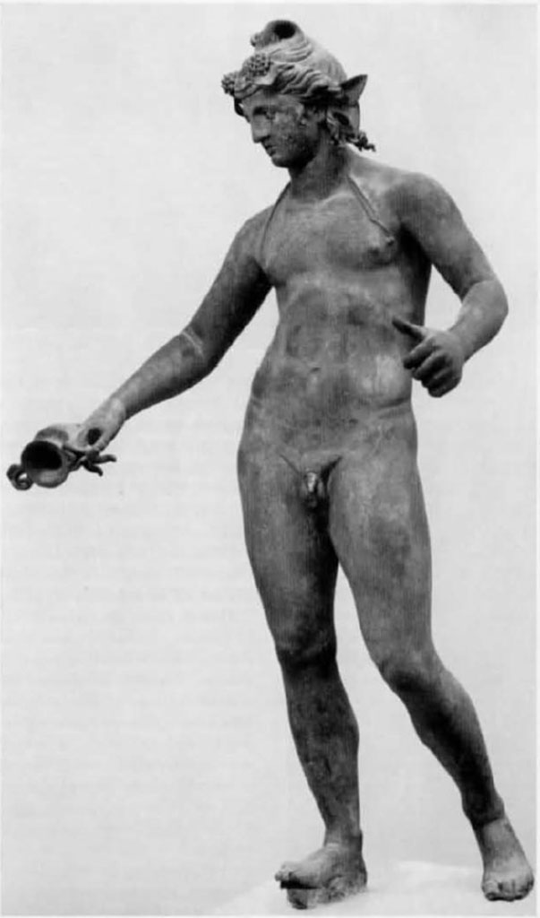 I.16.1a, Pompeii. Bronze statue of a young Bacchus on display in Pompeii Antiquarium, see VIII.1.4.
Found in a cubiculum adjacent to the fauces of I.16.2 on 26th September 1957. 
See Elia, O., 1961. Bacco Fanciullo e Dioniso Chtonio a Pompei: Bollettino d’Arte 1961, Fasc I-II, (p.1.fig.1). 
