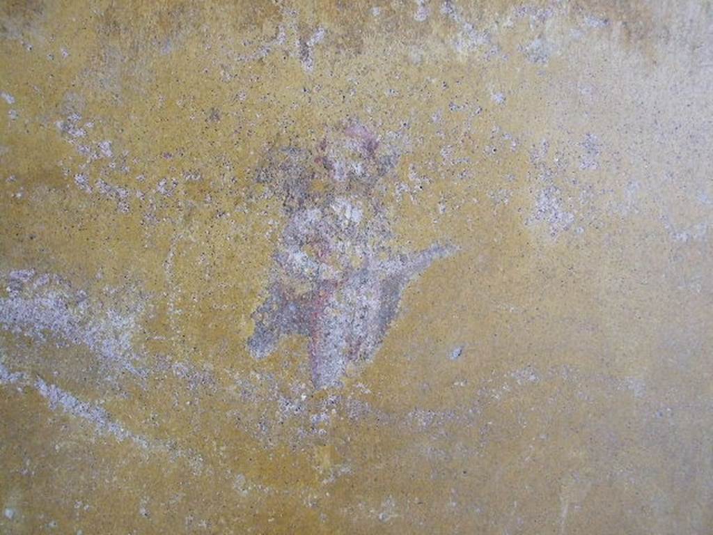 I.16.4 Pompeii. December 2006. Detail of wall painting of cupid from east wall of cubiculum.