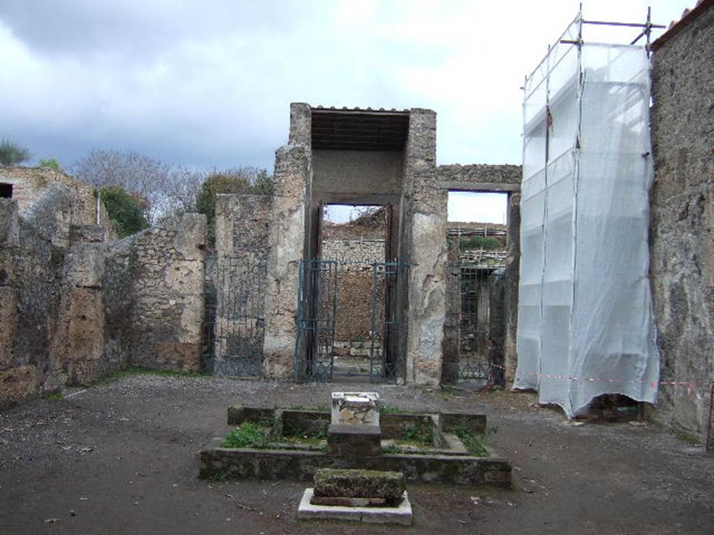 II.2.2 Pompeii. December 2005.  
Room 2, looking north across atrium to entrance. The doorway to room 3 is behind scaffolding.

