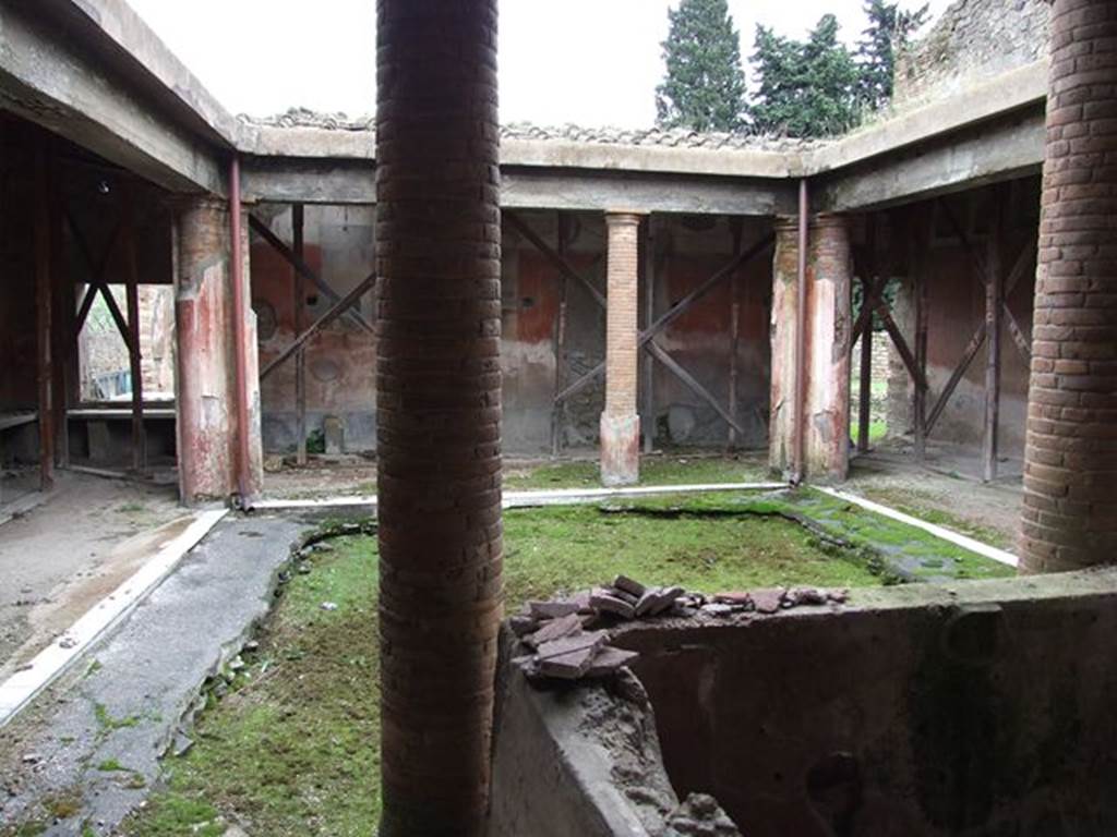 II.4.6 Pompeii. December 2006. Looking north along east wall towards benches and entrance doorway.
