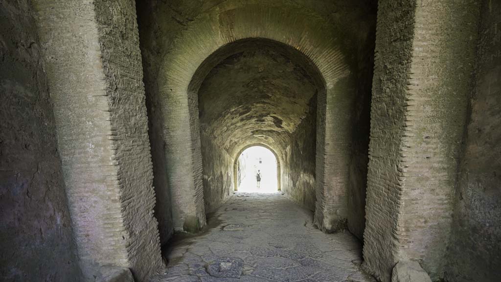 II.6 Pompeii. August 2021. Looking south down sloping corridor towards arena. Photo courtesy of Robert Hanson.