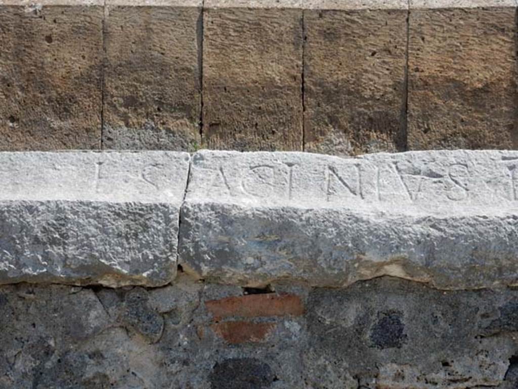 II.6 Pompeii. May 2016. Inscription carved on rim of inner wall of the arena of the Amphitheatre.
Inscription L. SAGINIVS, part of CIL X 855.  Photo courtesy of Buzz Ferebee.


