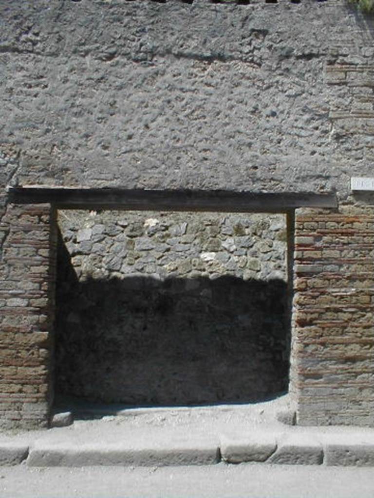 III.2.3 Pompeii. May 2005. Entrance doorway, partly excavated.
According to Varone and Stefani, found on the right pilaster was 
L(ucium)  Ceium  IIvir(um)  i(ure)  d(icundo)     [CIL IV 9931a]
This is no longer visible, but a small amount of white on the brickwork marks the spot. See Varone, A. and Stefani, G., 2009. Titulorum Pictorum Pompeianorum, Rome: Lerma di Bretschneider, (p.241)
According to Della Corte, to the right of the entrance was found 
Priscum  aed(ilem)  
o(ro)  v(os)  f(aciatis)  Lutati   fac(iunt)    [CIL IV 7636]
See Della Corte, M., 1965.  Case ed Abitanti di Pompei. Napoli: Fausto Fiorentino. (p.349)
