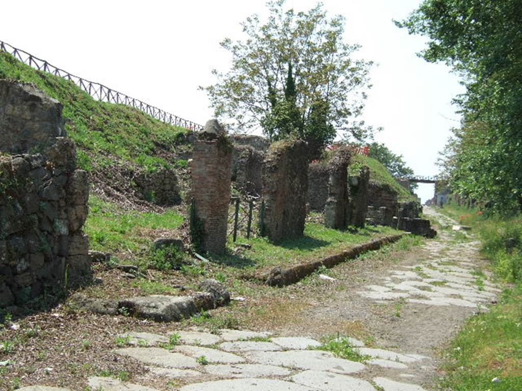 III.11.6 Pompeii.. May 2006. Entrance with lowered kerb, and view across Insula III.11 on Via di Nola.
