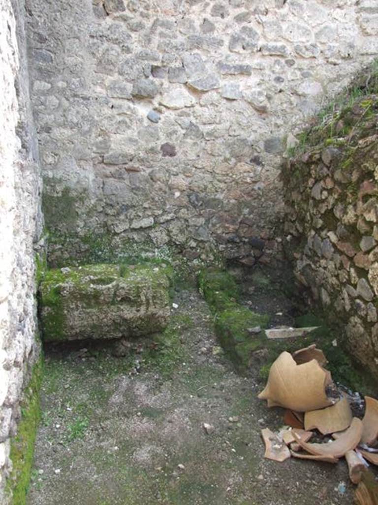 V.1.15 Pompeii. April 2009. 
Looking south through doorway into kitchen/latrine in south-east corner of bakery 
