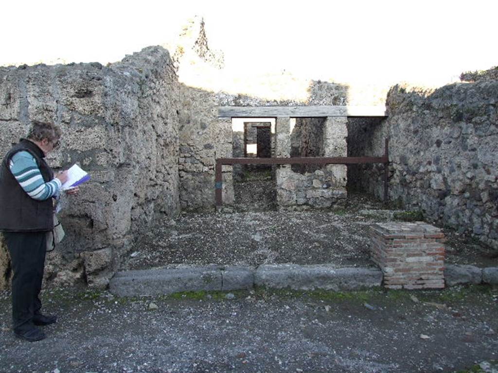 V.1.20 Pompeii. December 2006. Looking east across shop to dwelling at rear.