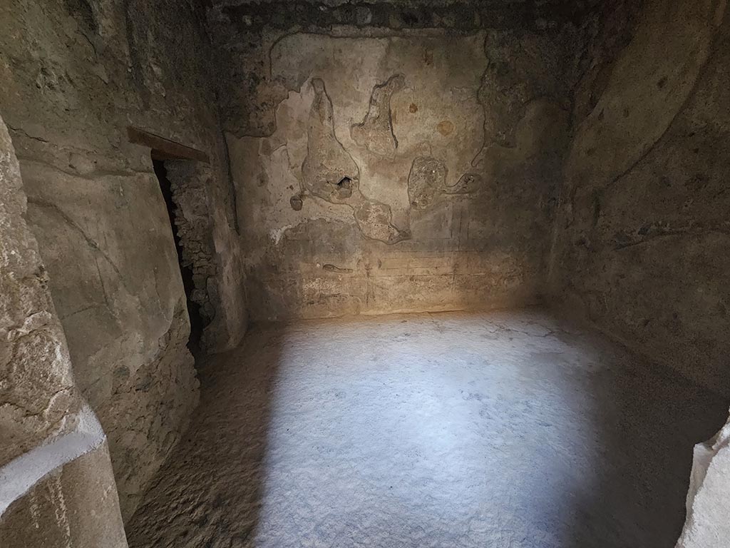 V.2.i Pompeii. November 2024. Room 2b, looking through doorway towards west wall. Photo courtesy of Annette Haug.