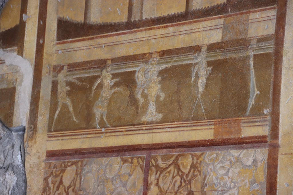 V.2.i Pompeii. October 2023. Room 19, detail from centre of upper west wall. Photo courtesy of Klaus Heese.