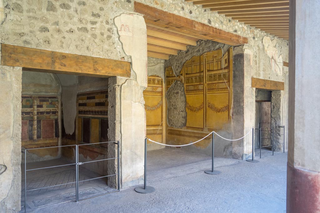 V.2.i Pompeii. August 2023. South portico of peristyle, with doorway to room 20, on left. Photo courtesy of Johannes Eber.


